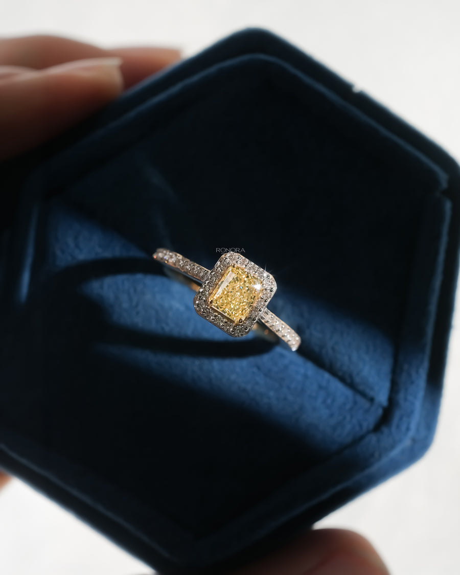 Fancy yellow lab grown diamond halo engagement ring in a blue Ronora box
