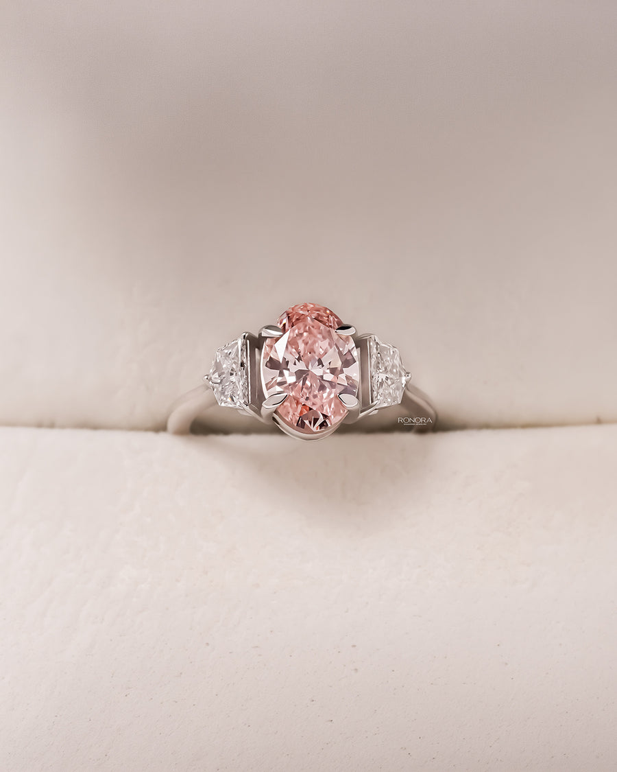 Roselle pink lab grown diamond three-stone ring in white metal inside Ronora box