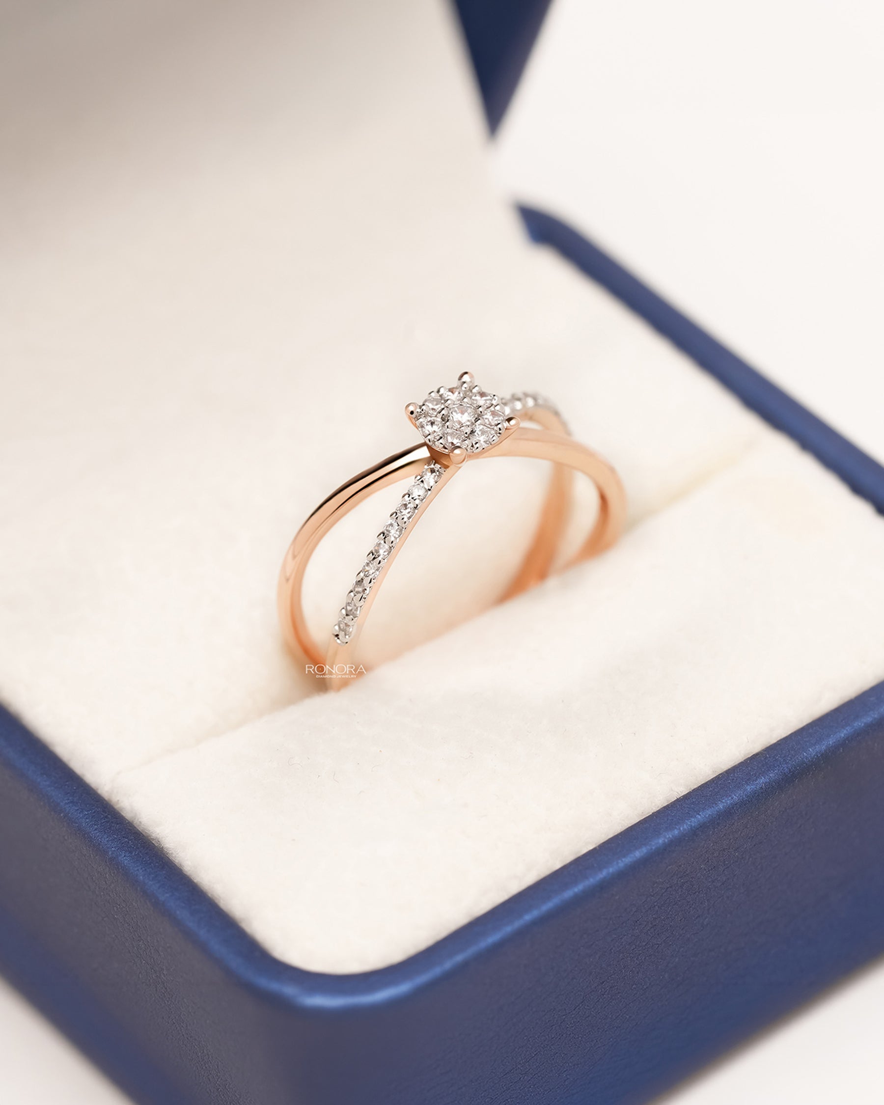 Angled view of round lab grown diamond split-shank ring showing split pavé setting