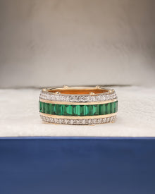 Emerelle green lab grown diamond channel band in yellow gold inside Ronora box