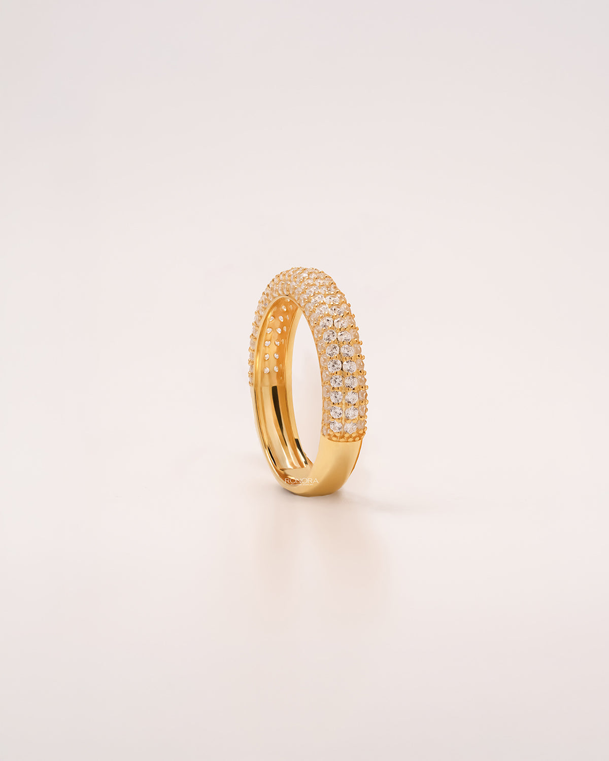 Angled view of wide lab grown diamond pavé band showing multi-row pavé setting