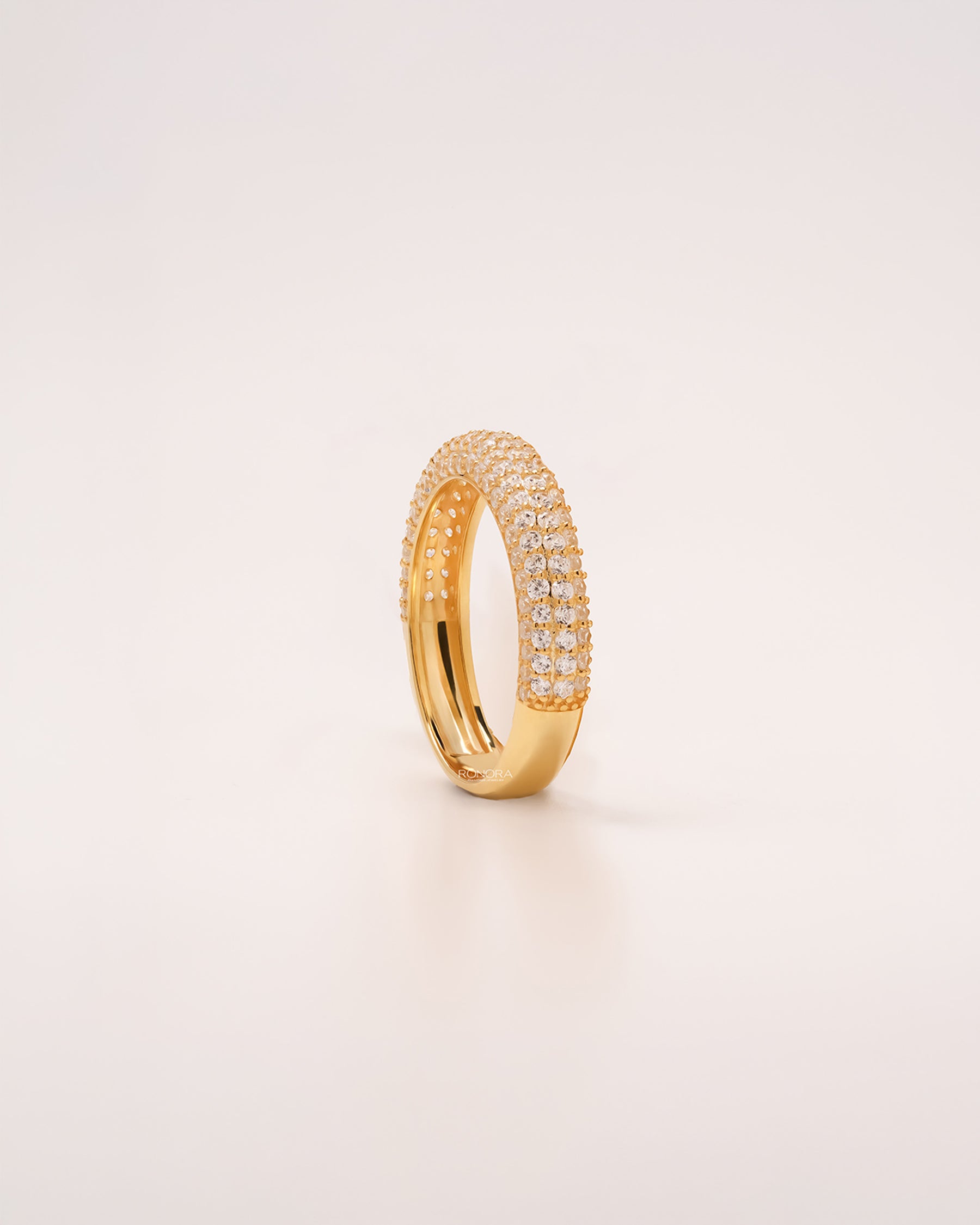 Angled view of wide lab grown diamond pavé band showing multi-row pavé setting