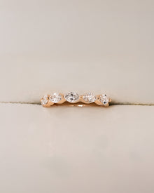 Juliette round lab grown diamond five-stone band in yellow gold inside Ronora box