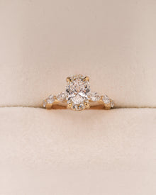 Celeste oval lab grown diamond side-stone ring in yellow gold inside Ronora box