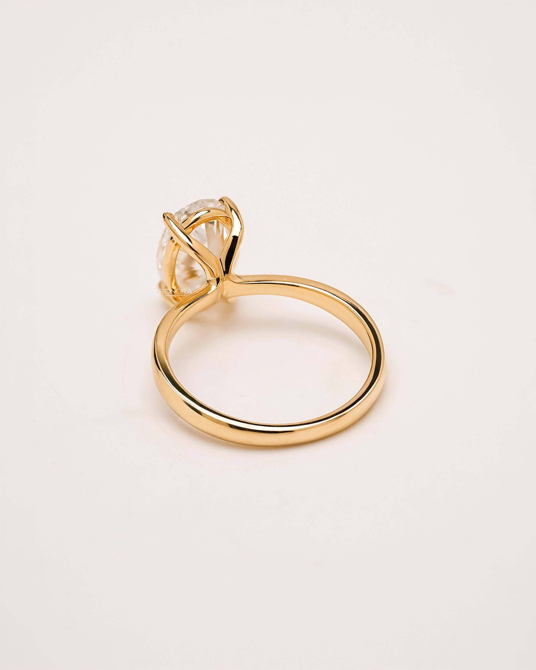 Side profile of oval lab grown diamond solitaire ring showing solitaire setting