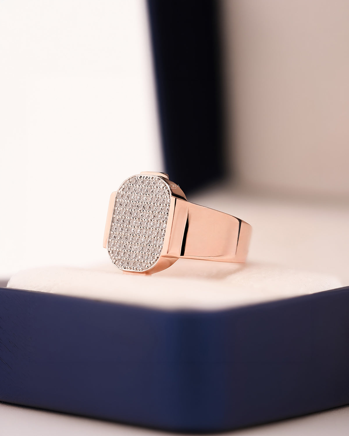 Angled view of square lab grown diamond pavé signet ring showing pavé signet setting