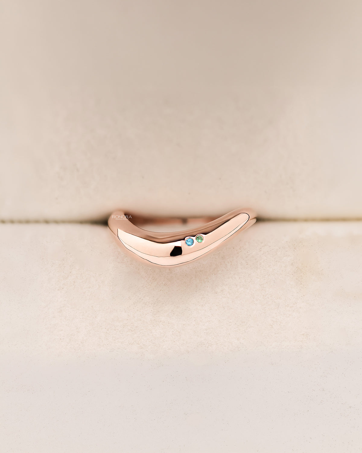Lyra blue accent lab grown diamond curved ring in rose gold inside Ronora box