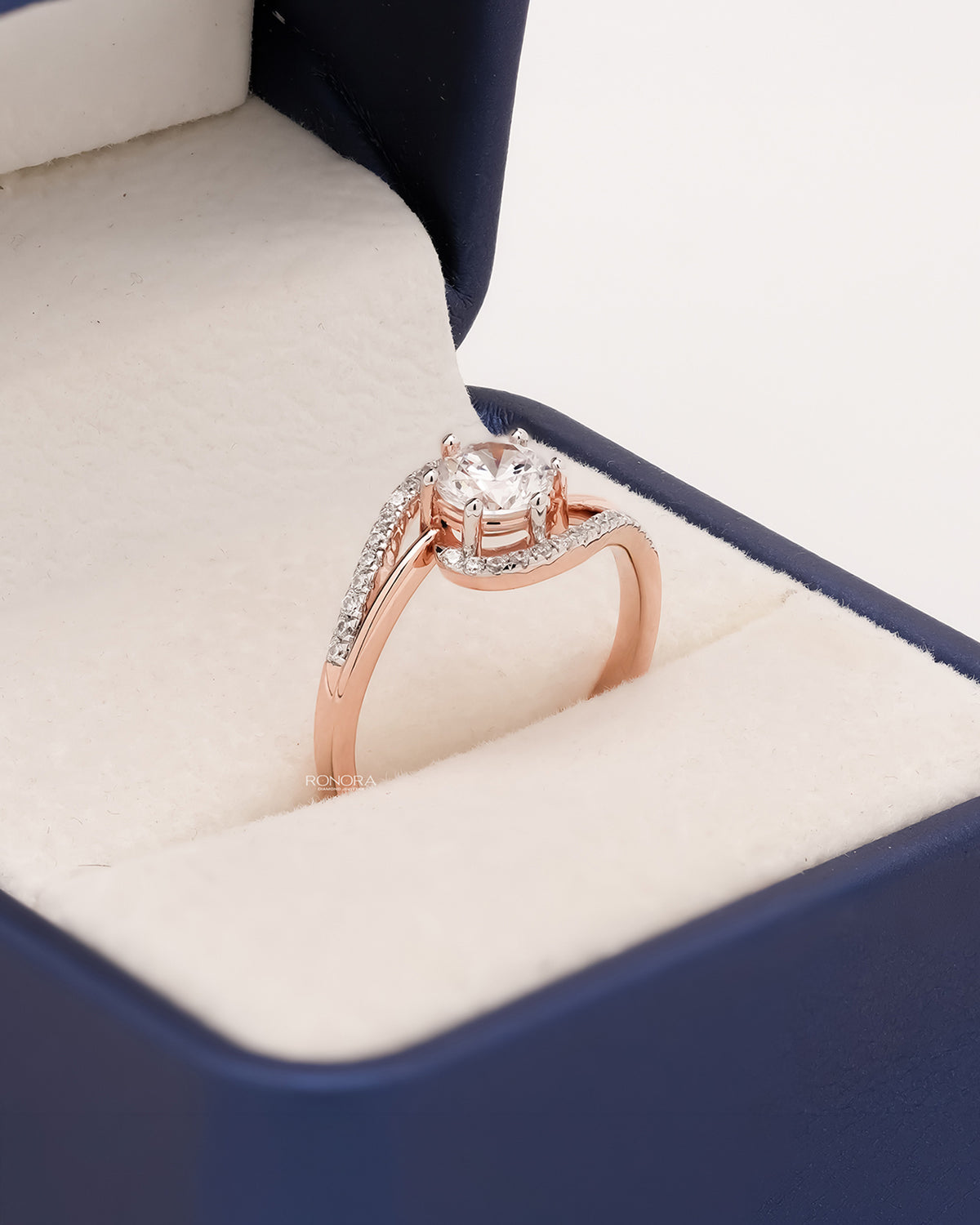 Angled view of round lab grown diamond twisted pavé ring showing twisted pavé setting