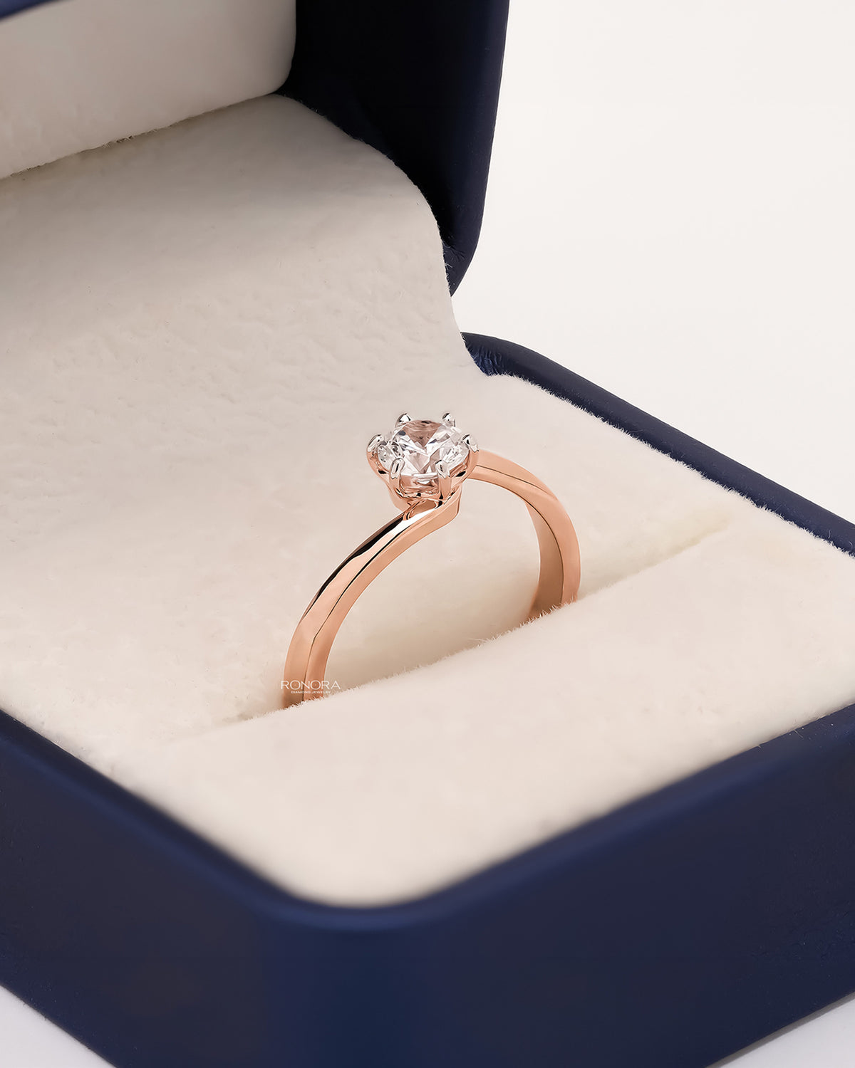 Angled view of round lab grown diamond bypass ring showing bypass setting
