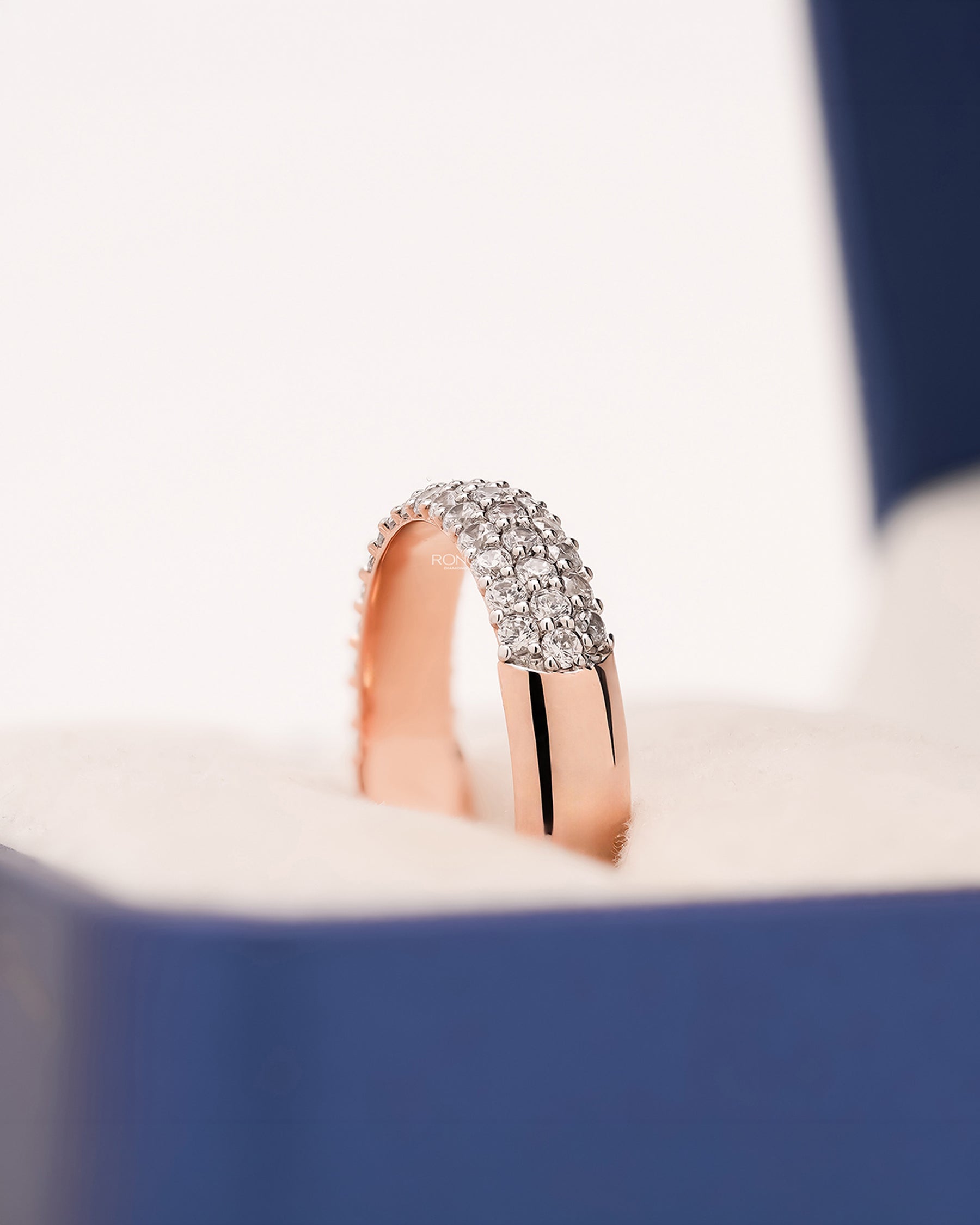 Side profile of wide lab grown diamond pavé band showing multi-row pavé setting