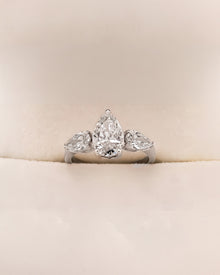 Ophelia pear lab grown diamond three-stone ring in white metal inside Ronora box