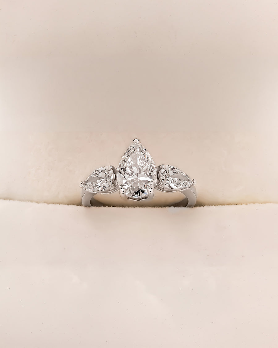 Ophelia pear lab grown diamond three-stone ring in white metal inside Ronora box