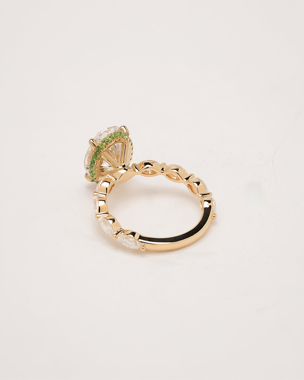 Back view of oval marquise lab grown diamond three-stone ring showing band and gallery detail