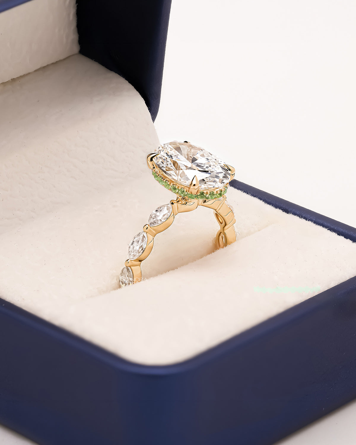 Angled view of oval marquise lab grown diamond three-stone ring showing ornate three-stone setting