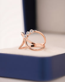 Angled view of open lab grown diamond swirl ring showing open accent setting
