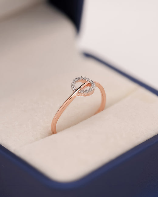 Delphine round lab grown diamond bypass ring in rose gold inside Ronora box