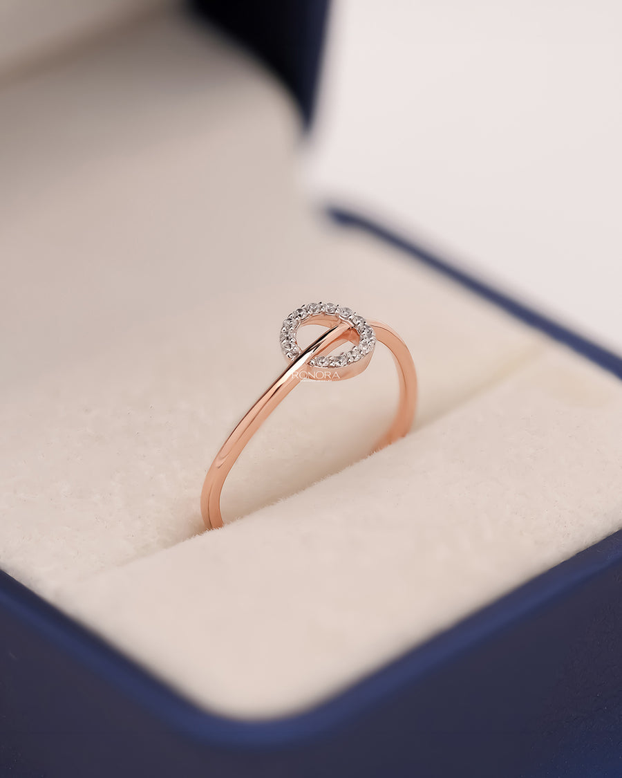 Delphine round lab grown diamond bypass ring in rose gold inside Ronora box