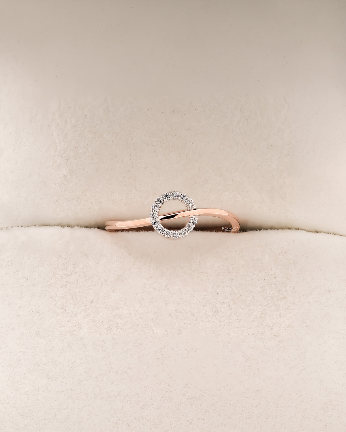Front view of round lab grown diamond bypass ring with open swirl setting