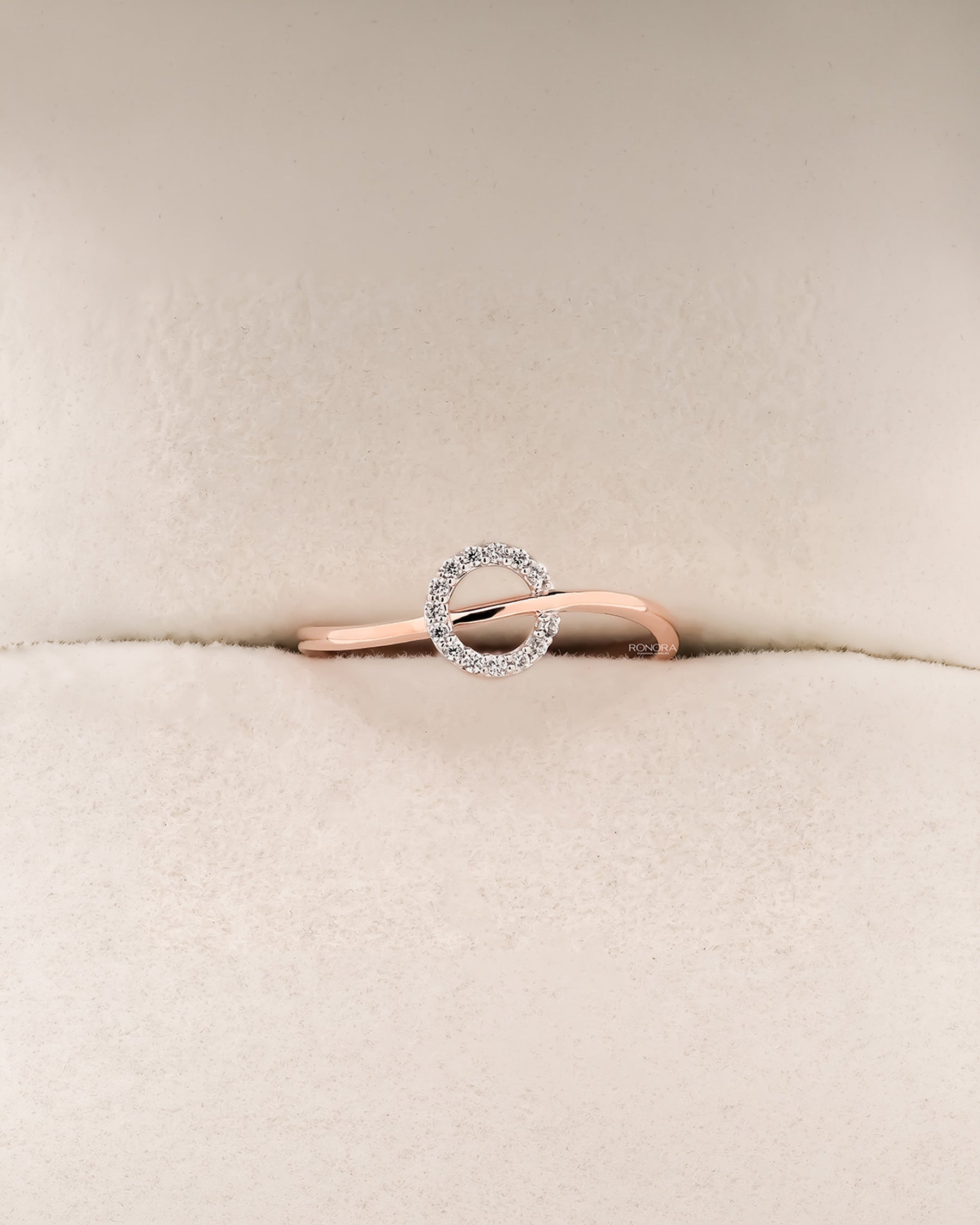Front view of round lab grown diamond bypass ring with open swirl setting