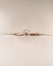 Front view of round lab grown diamond bypass ring with open swirl setting