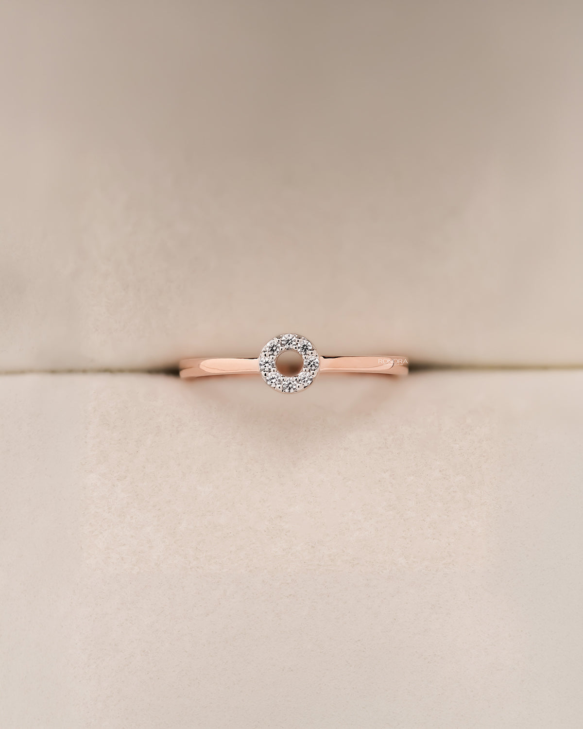 Front view of round lab grown diamond halo ring with floral halo setting