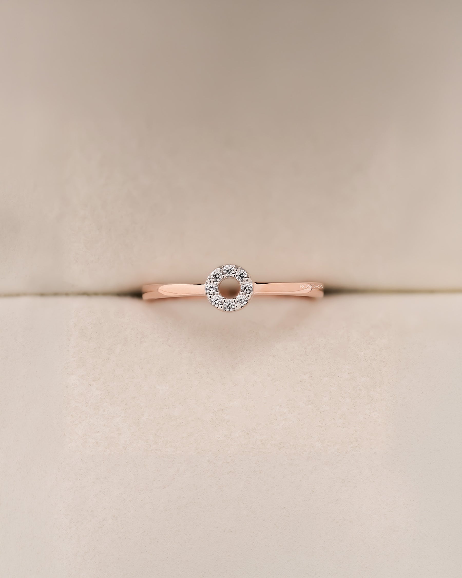 Front view of round lab grown diamond halo ring with floral halo setting