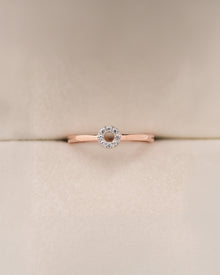 Front view of round lab grown diamond halo ring with floral halo setting