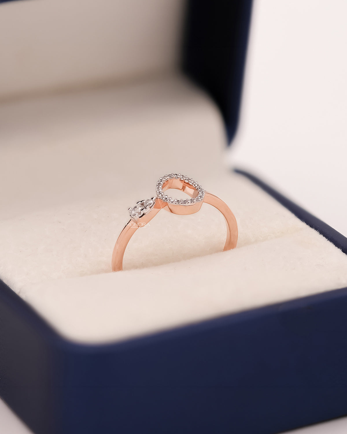 Sabine round lab grown diamond open halo ring in rose gold inside Ronora box