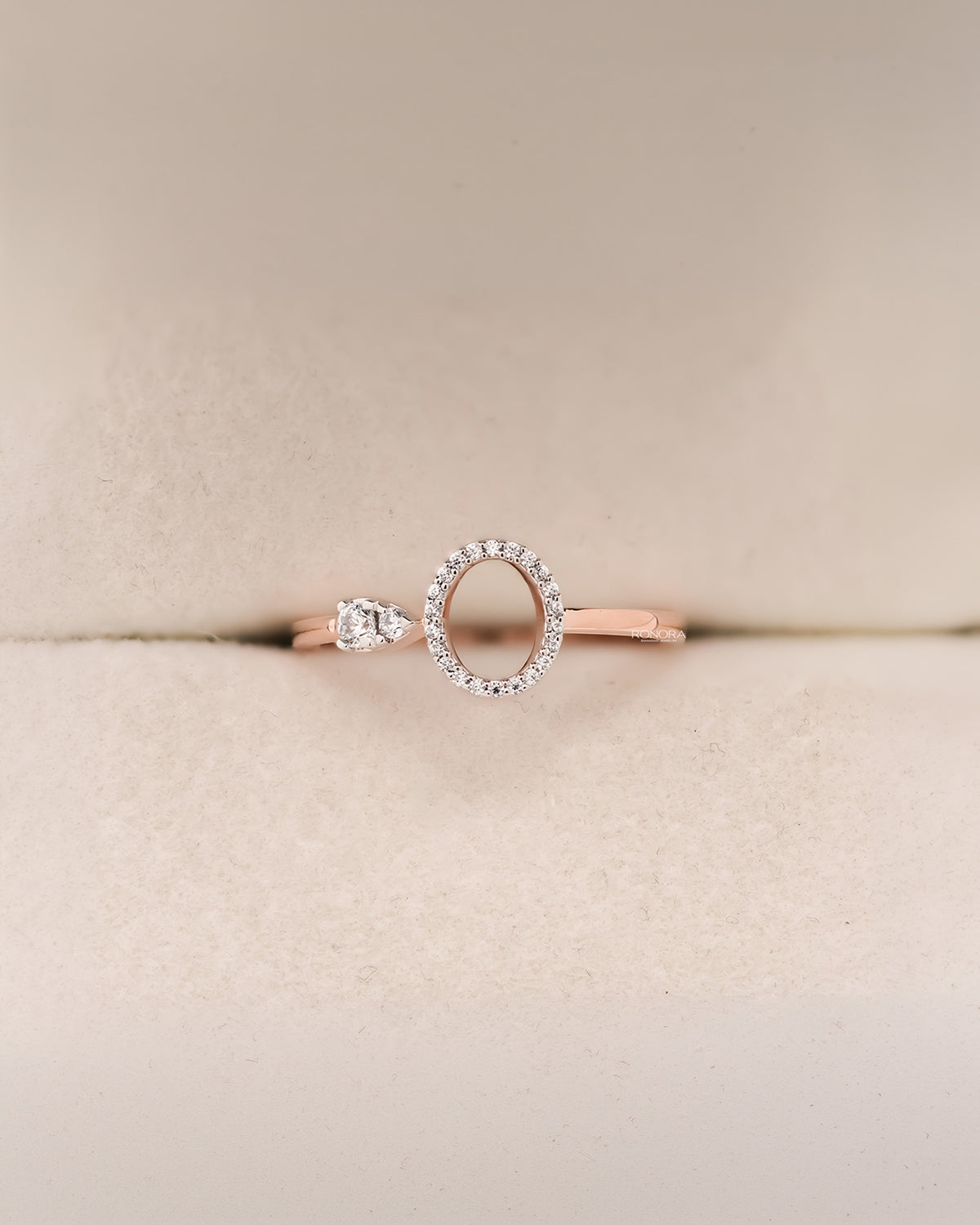 Front view of round lab grown diamond open halo ring with airy circle detail