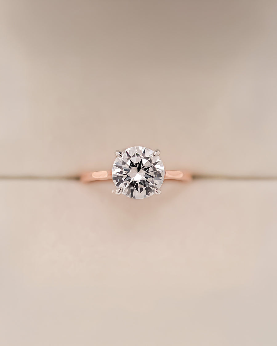 Clarisse round moissanite solitaire ring in rose gold front view