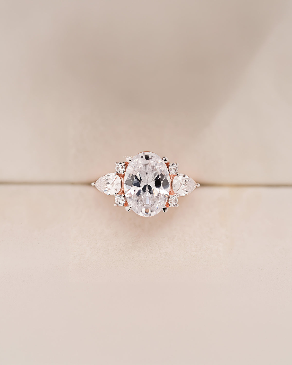 Isadora oval moissanite three-stone ring in rose gold front view