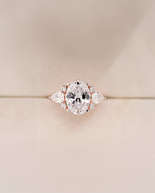 Isadora oval moissanite three-stone ring in rose gold front view