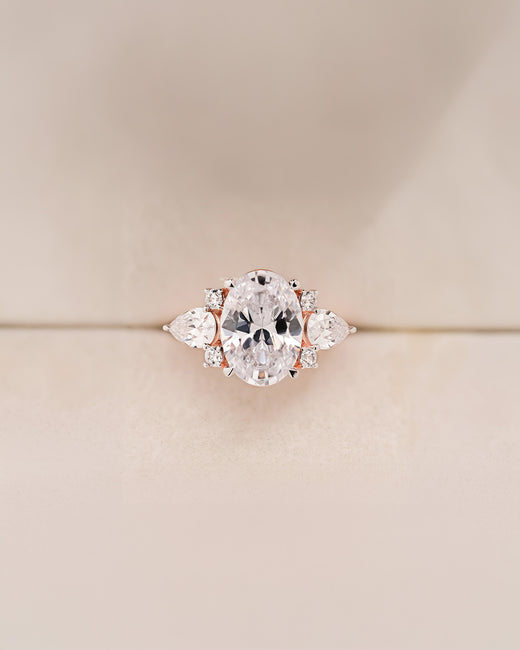 Isadora oval moissanite three-stone ring in rose gold front view