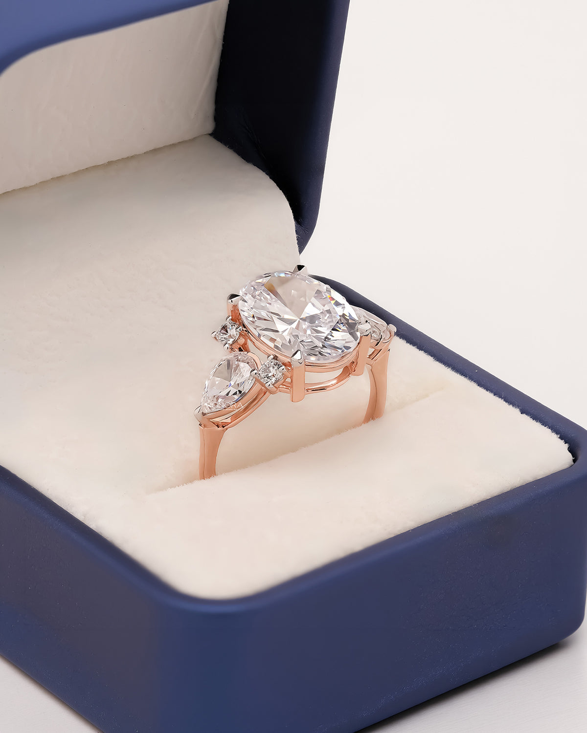 Oval moissanite three-stone ring in Ronora box showing statement setting