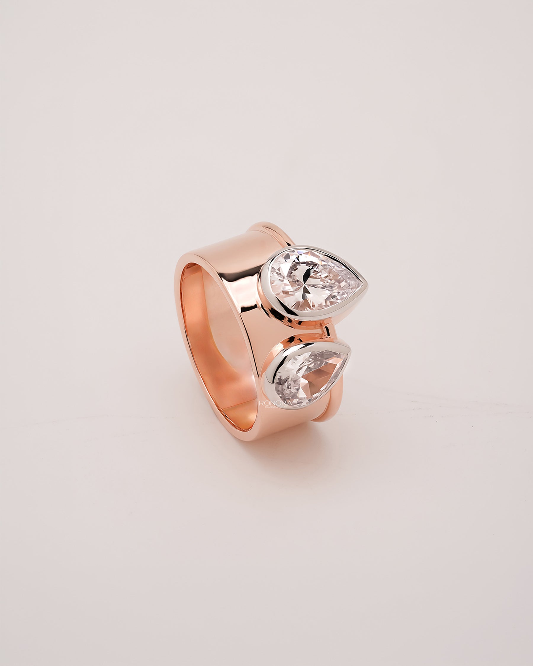 Side profile of pear lab grown diamond bypass ring showing ring setting