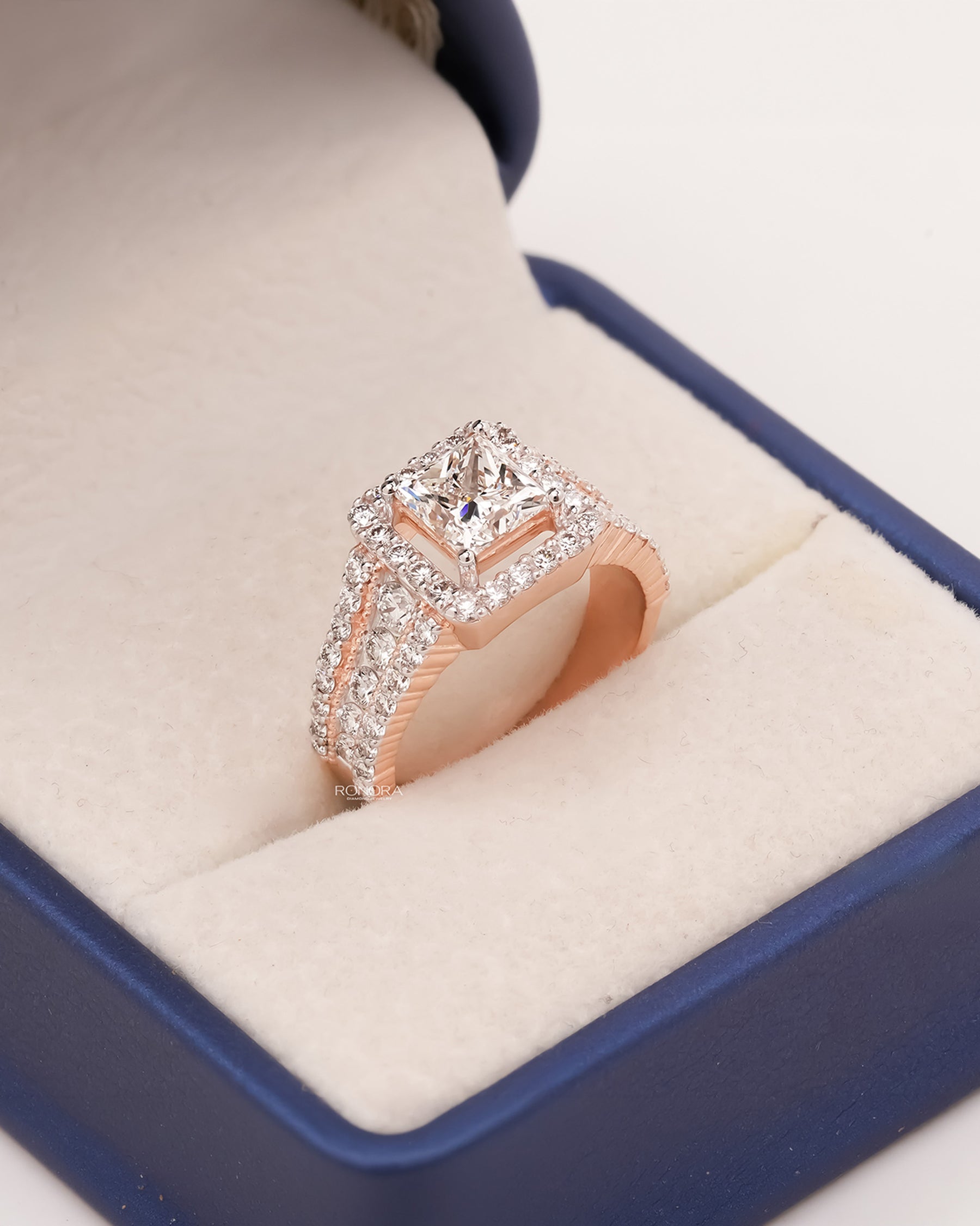 Angled view of princess lab grown diamond halo ring with halo pave setting