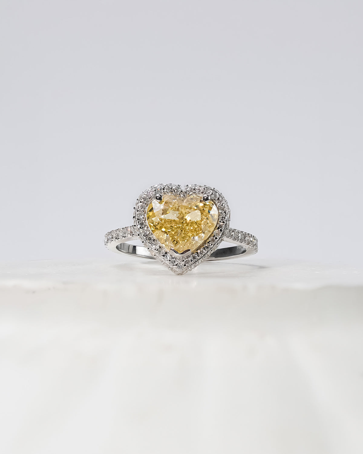 Aurielle yellow heart lab grown diamond halo ring in white gold inside Ronora box