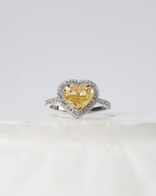 Aurielle yellow heart lab grown diamond halo ring in white gold inside Ronora box