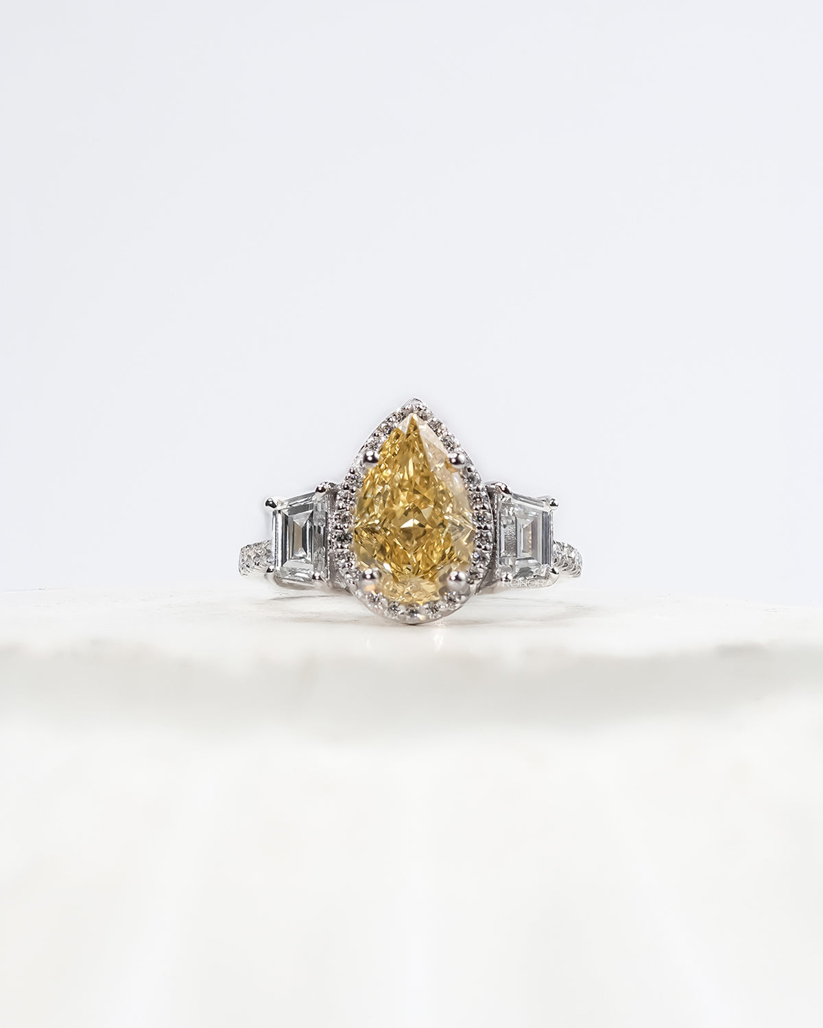 Marisol yellow pear lab grown diamond halo ring in white gold inside Ronora box