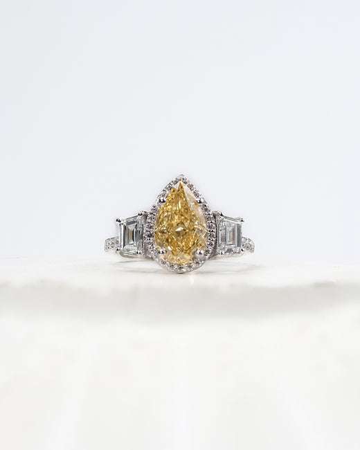 Marisol yellow pear lab grown diamond halo ring in white gold inside Ronora box