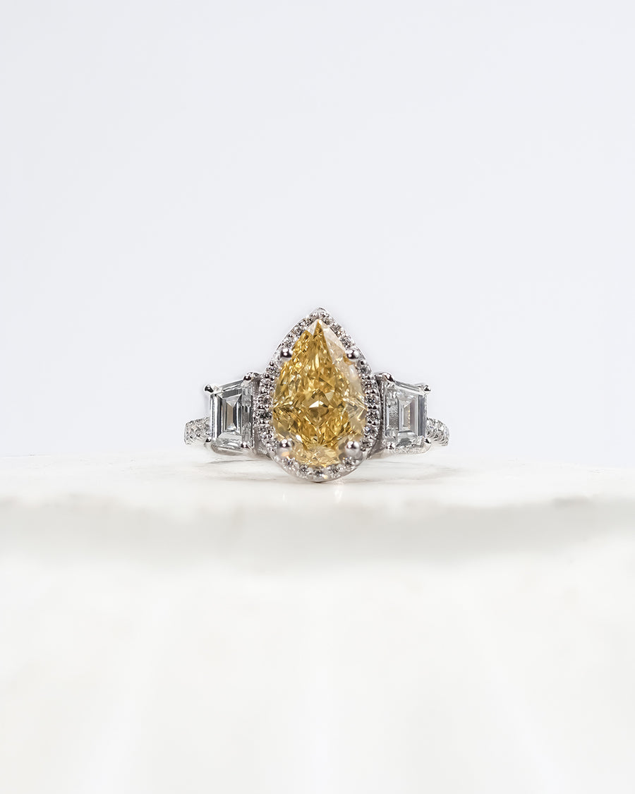 Marisol yellow pear lab grown diamond halo ring in white gold inside Ronora box