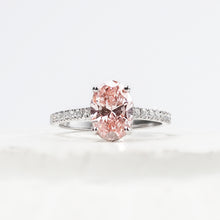 Rosalie pink oval lab grown diamond halo ring in white gold inside Ronora box