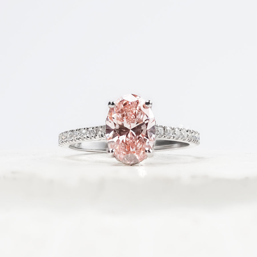 Rosalie pink oval lab grown diamond halo ring in white gold inside Ronora box