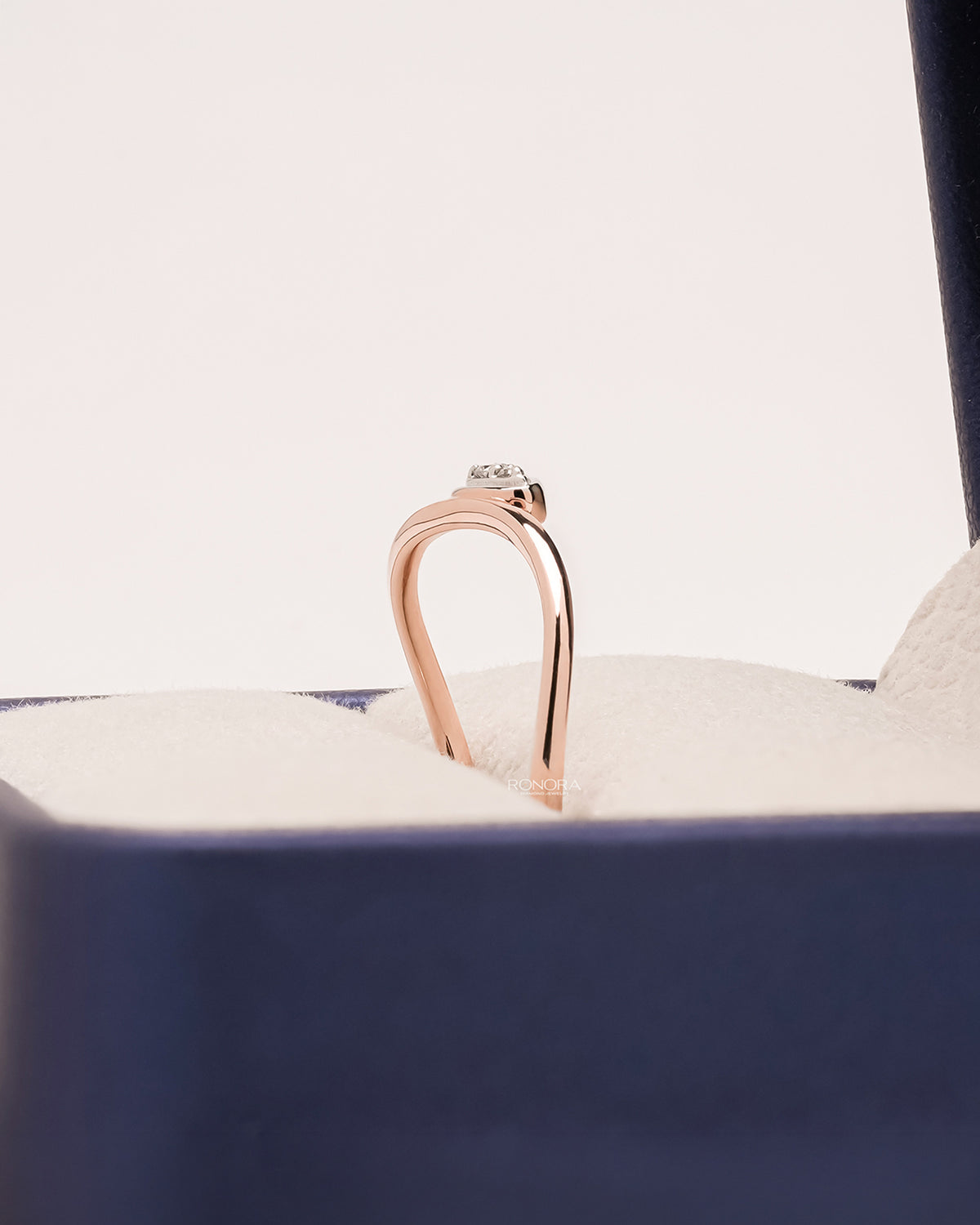 Side profile of round lab grown diamond solitaire ring showing ring setting