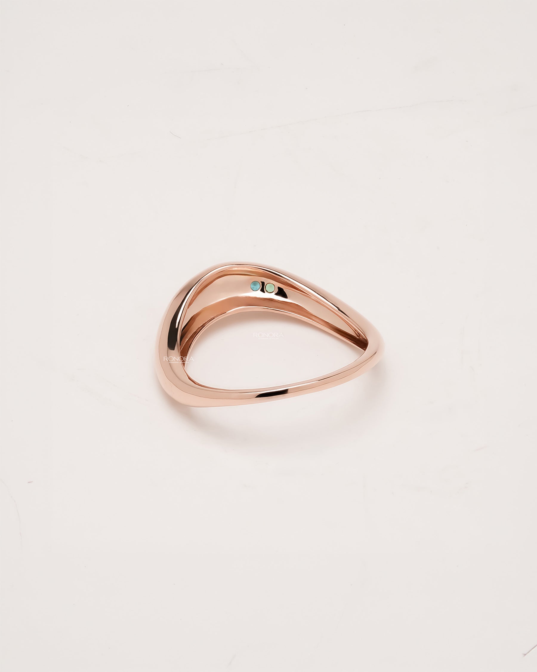 Back view of blue accent lab grown diamond curved ring showing band and gallery detail