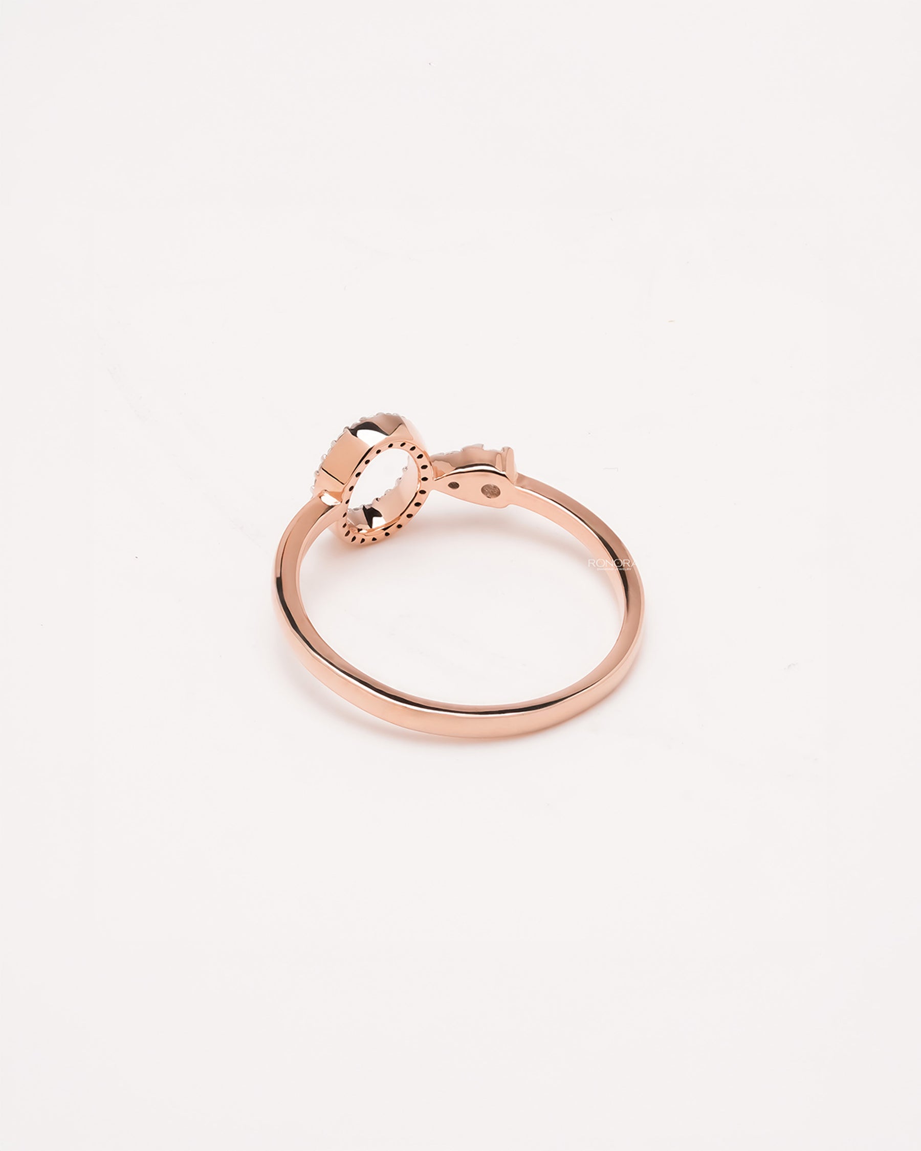 Back view of round lab grown diamond open halo ring showing slim rose gold band