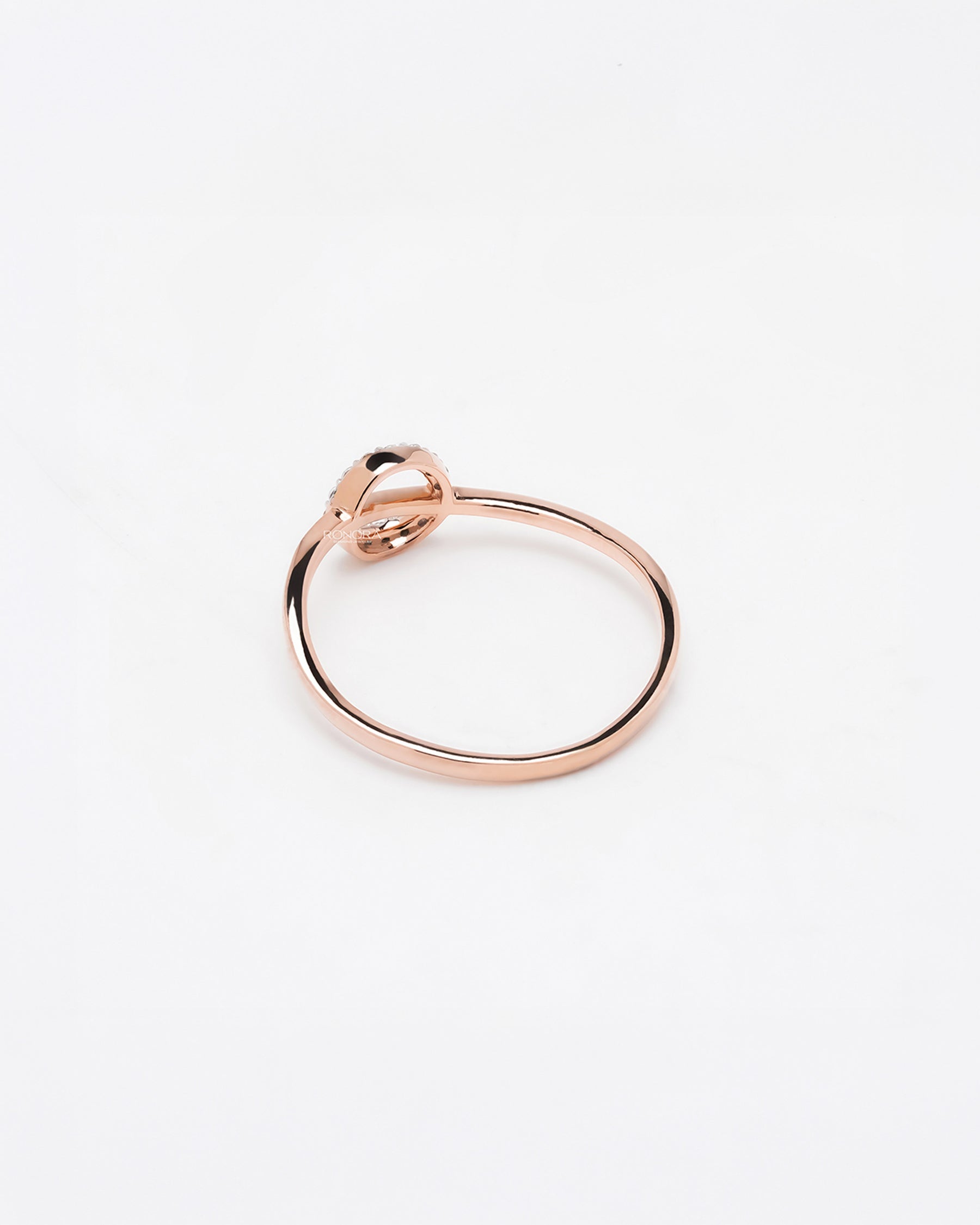 Back view of round lab grown diamond bypass ring showing slim rose gold band