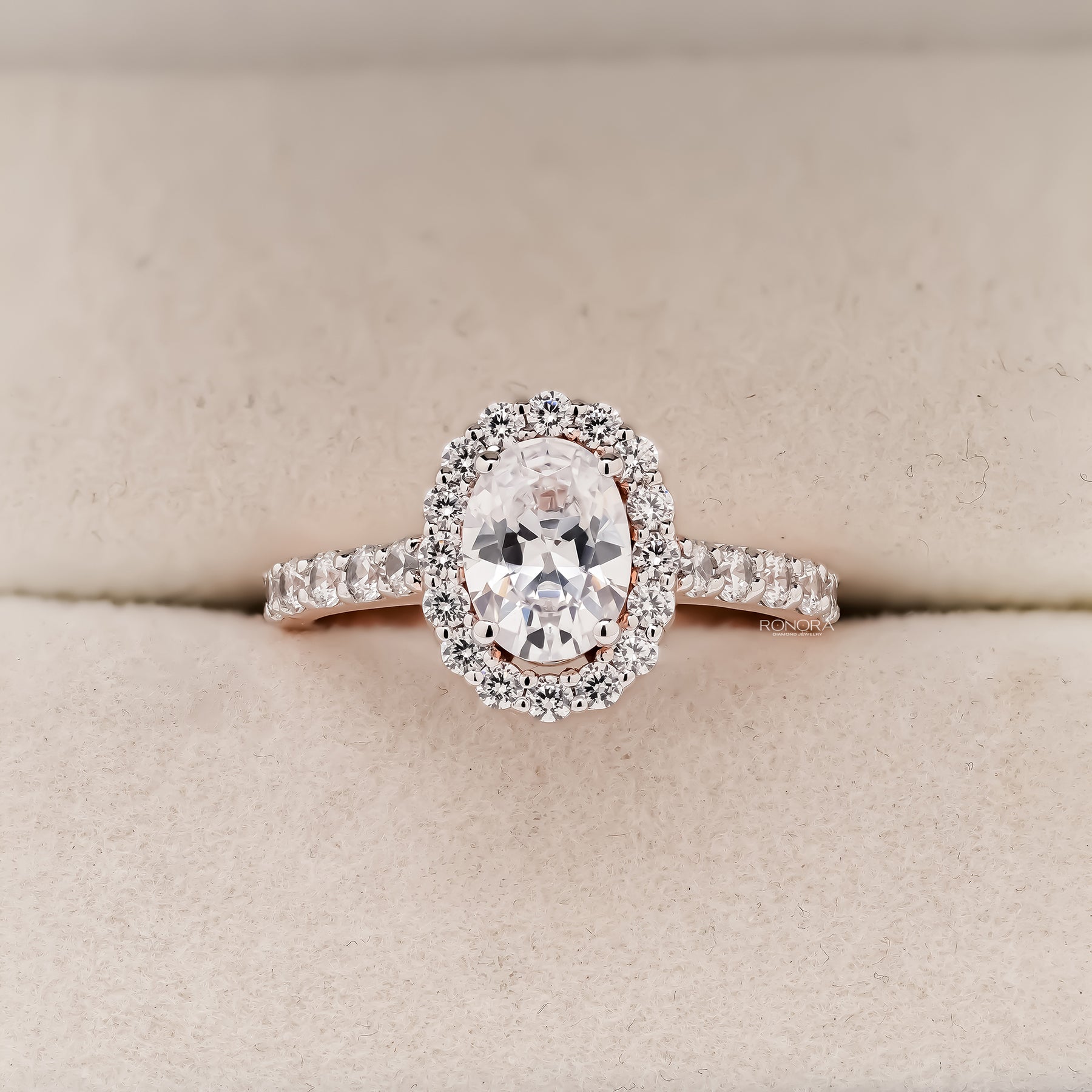Lucienne oval moissanite halo ring in rose gold inside Ronora box