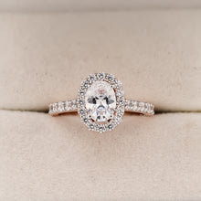 Lucienne oval moissanite halo ring in rose gold inside Ronora box