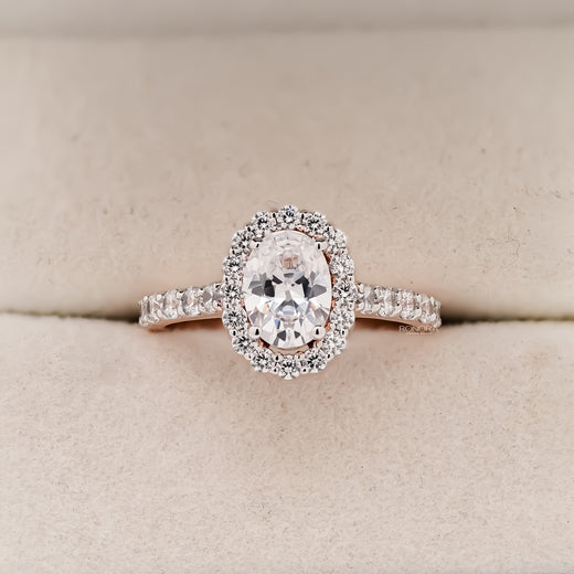 Lucienne oval moissanite halo ring in rose gold inside Ronora box